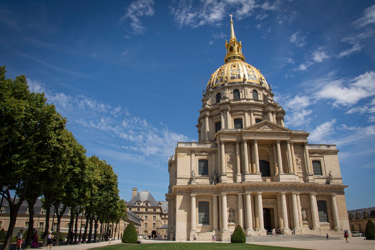 Full view of Les Invalides showing the golden dome and surrounding buildings in Paris