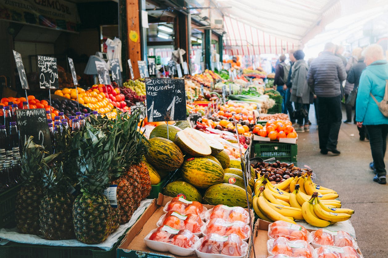 Colorful display of fruits and vegetables at an outdoor market