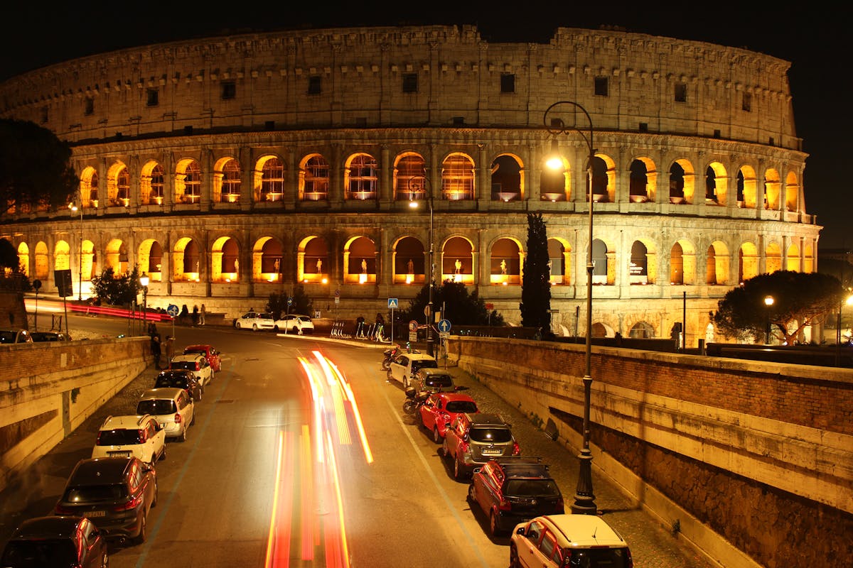 Night view of the Colosseum in Rome with dramatic lighting