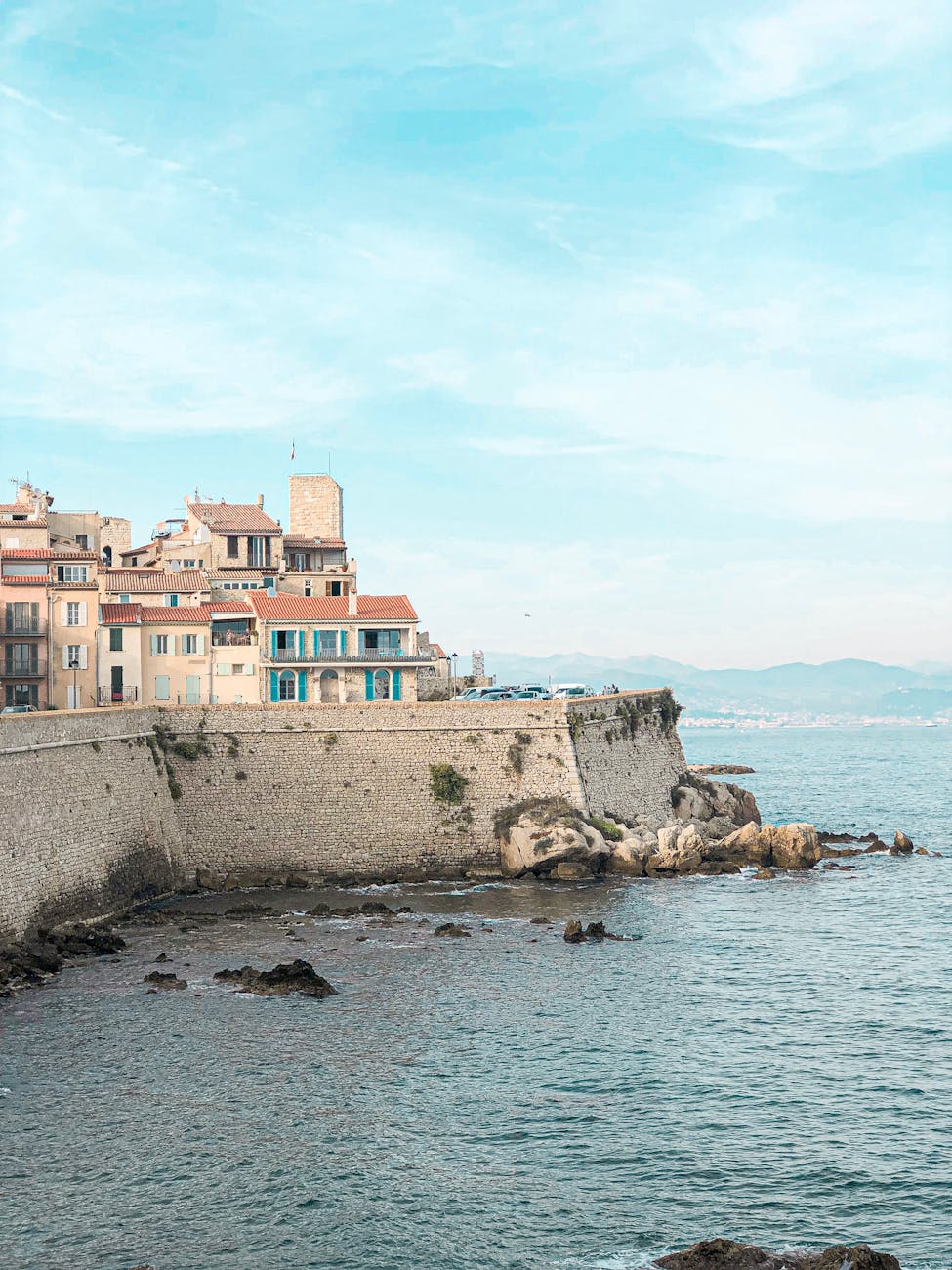 Antibes old town with stone walls and the Mediterranean visible behind the fort