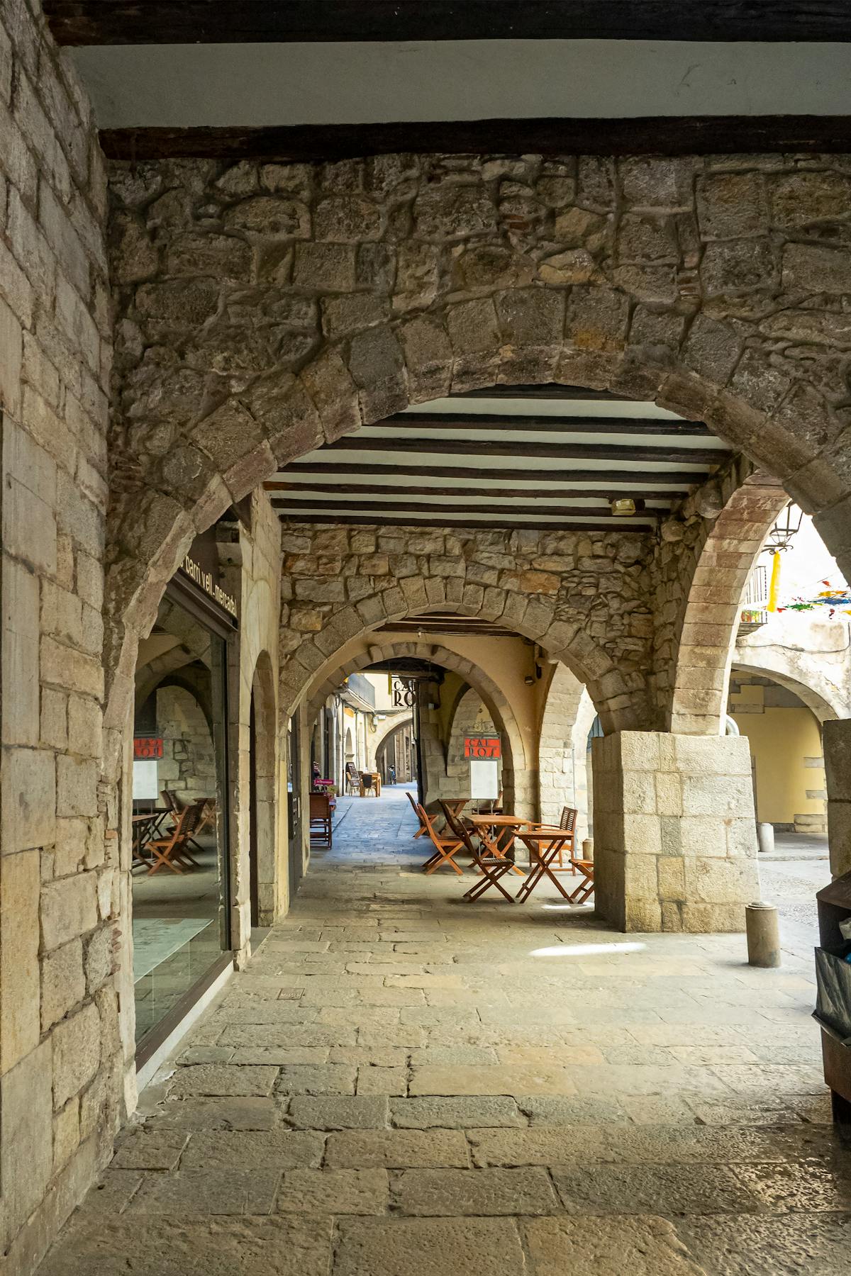 Stone arches in the historic streets of the Girona old town