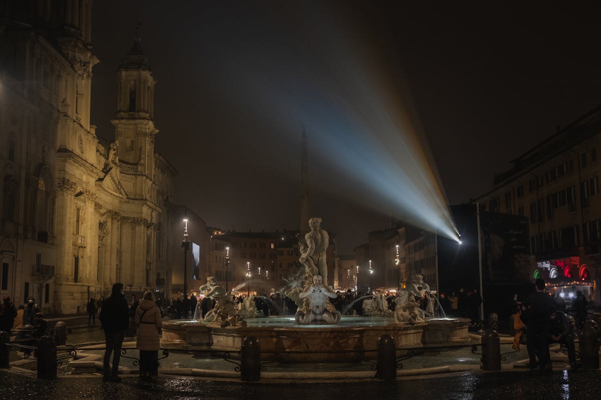 Historic fountain in Piazza Navona Rome illuminated at night