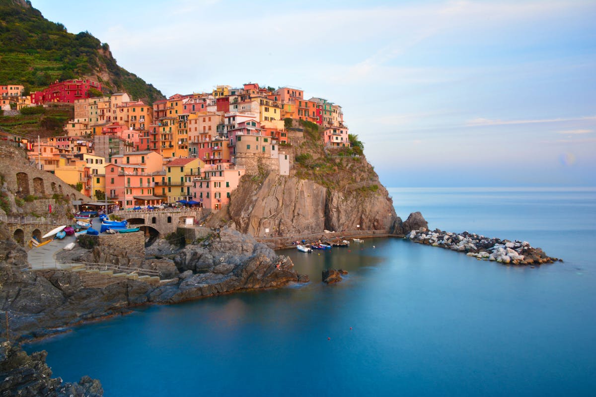 Colorful cliffside houses of Manarola overlooking the sea in Cinque Terre Italy