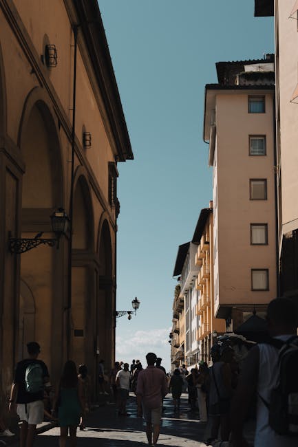Bustling street in Florence historic center with pedestrians and classic architecture