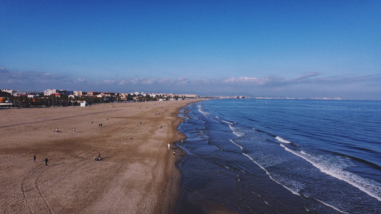 Aerial view of Valencia's long coastline with beach and city stretching into the distance