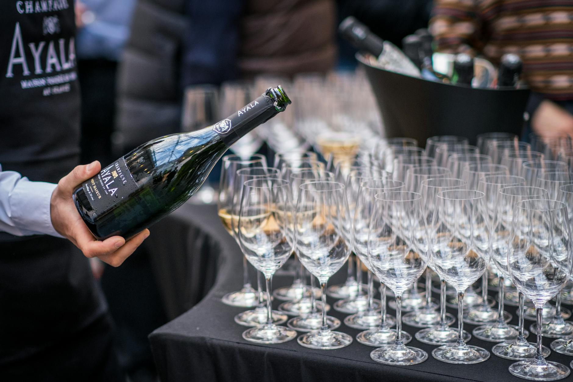 Two champagne glasses raised in a toast