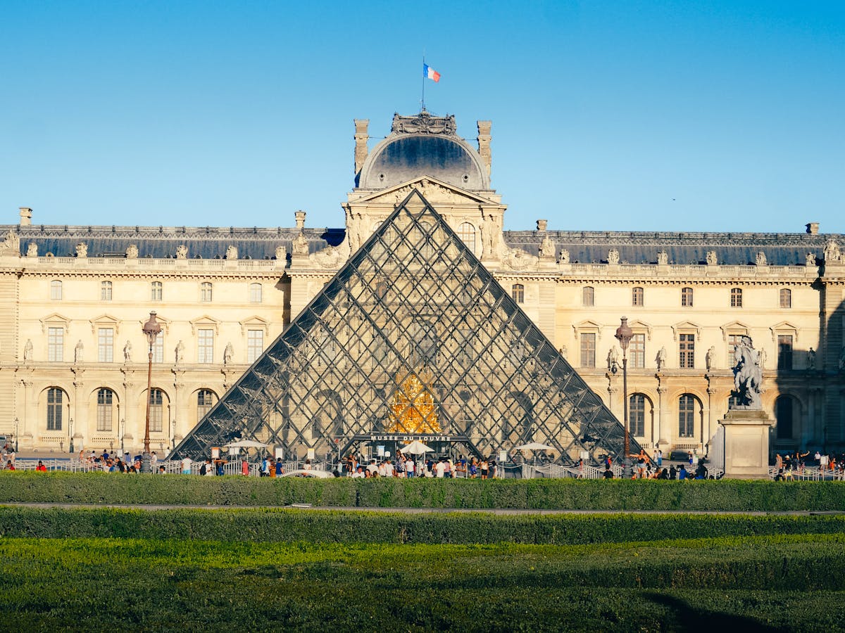 The Louvre Museum and glass pyramid -- one of the must-visit stops on any Paris bus route