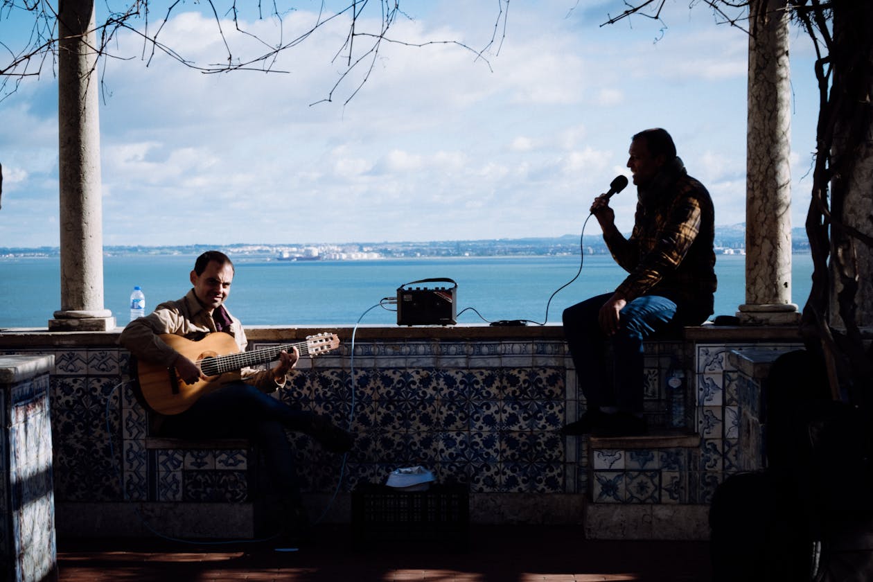 Fado musicians performing by the seaside in Lisbon