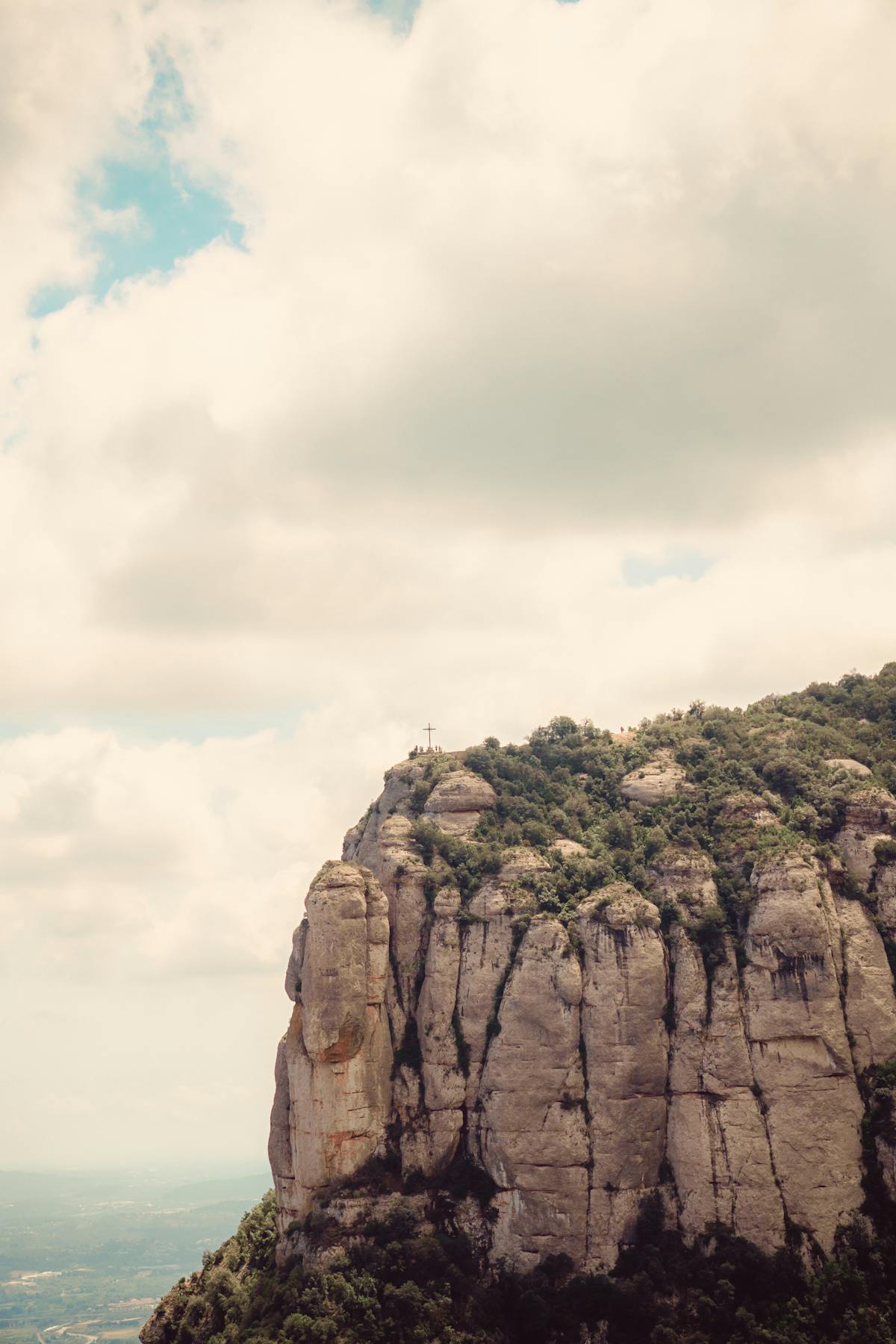 Close detail of Montserrat weathered conglomerate rock formations against blue sky