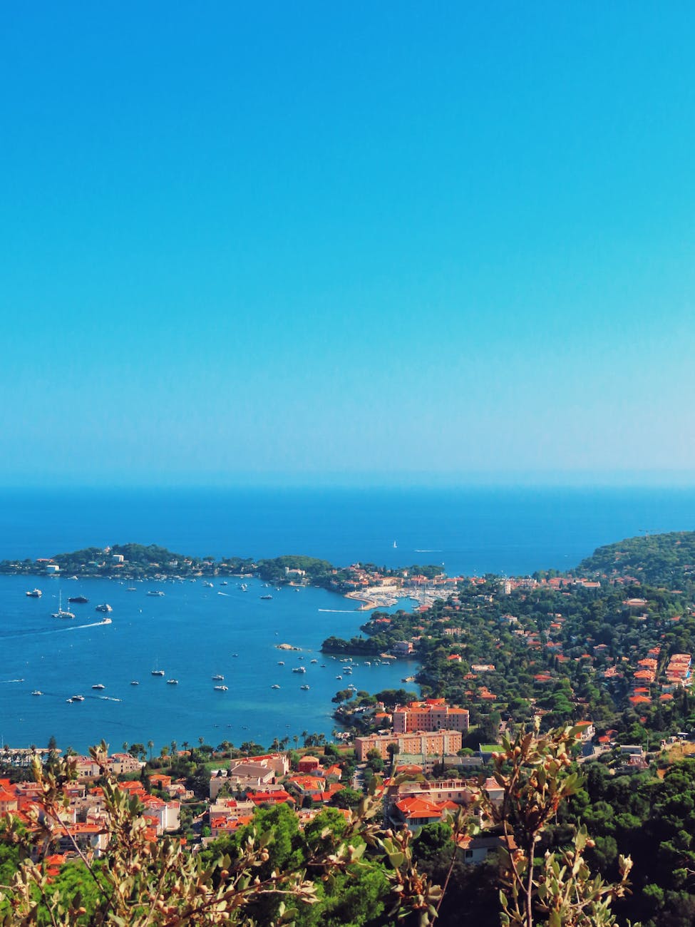 Villefranche-sur-Mer harbor with colourful buildings reflected in calm water