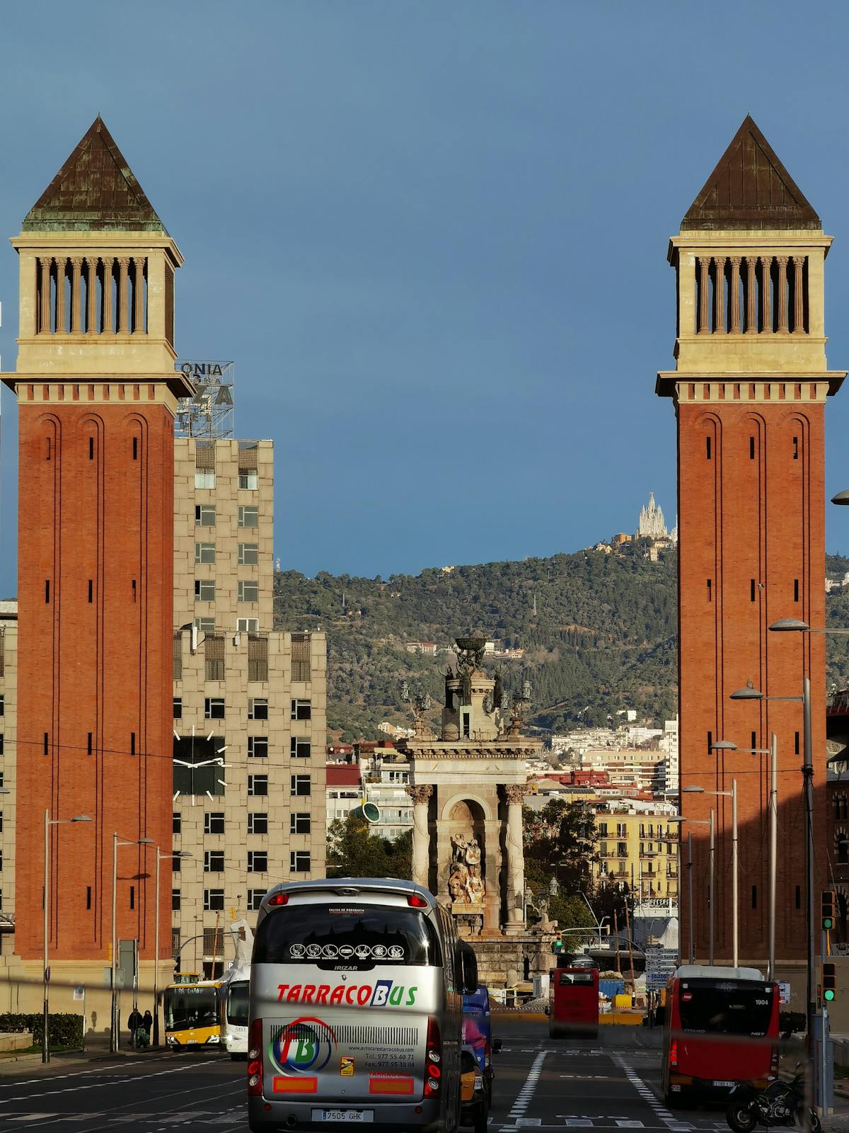 Barcelona Venetian Towers at Placa Espanya with crowd of people on a sunny day