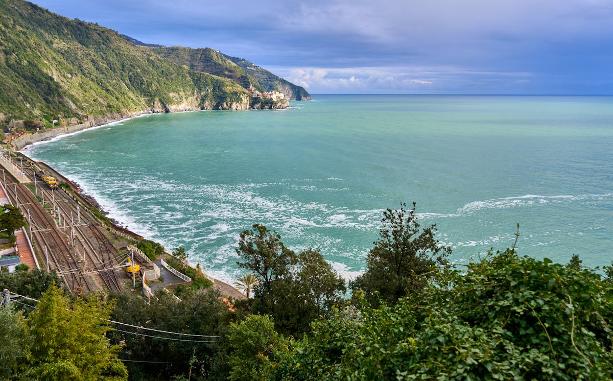 View of Ligurian coast with railway line running along the shoreline