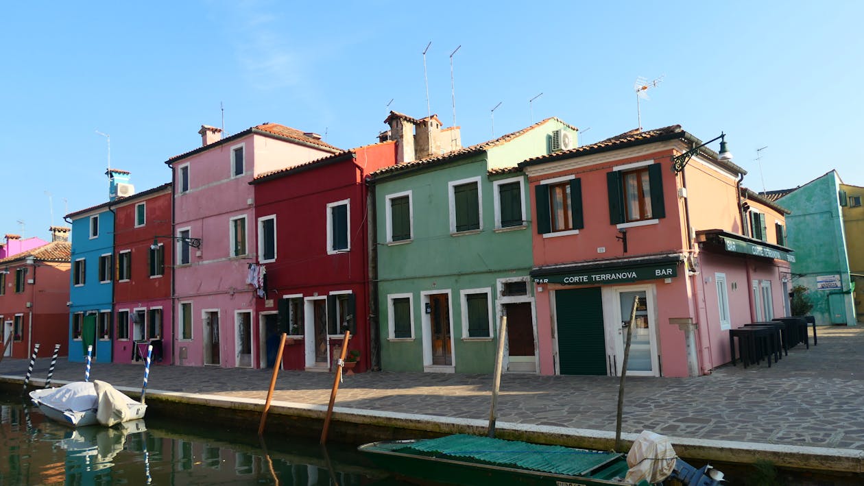 Colorful houses along a canal in Burano, Venice, Italy