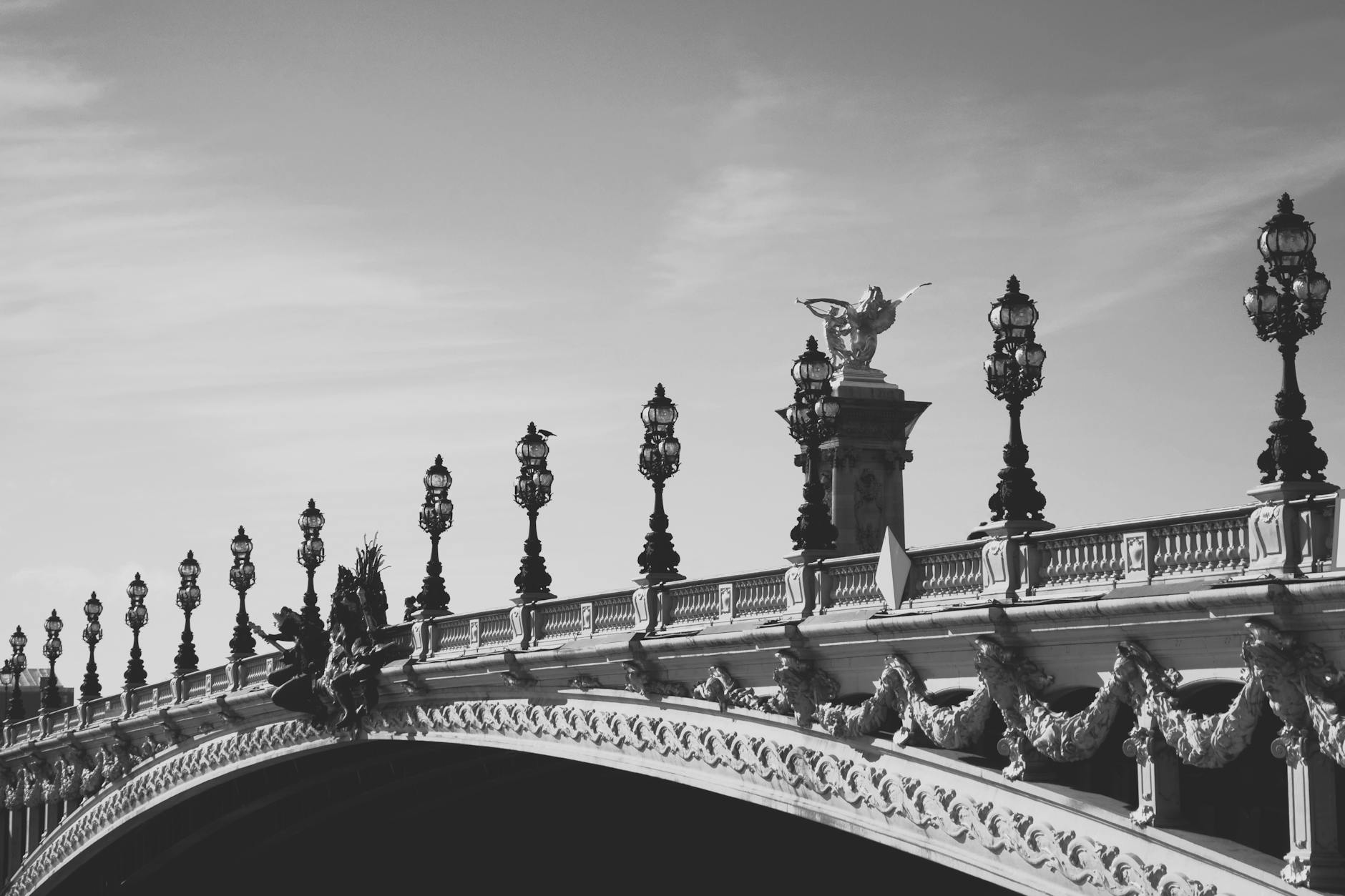 The ornate Pont Alexandre III bridge at dusk in Paris
