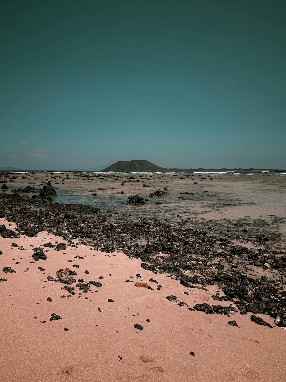 Beach scene with a volcanic island in the Canary Islands