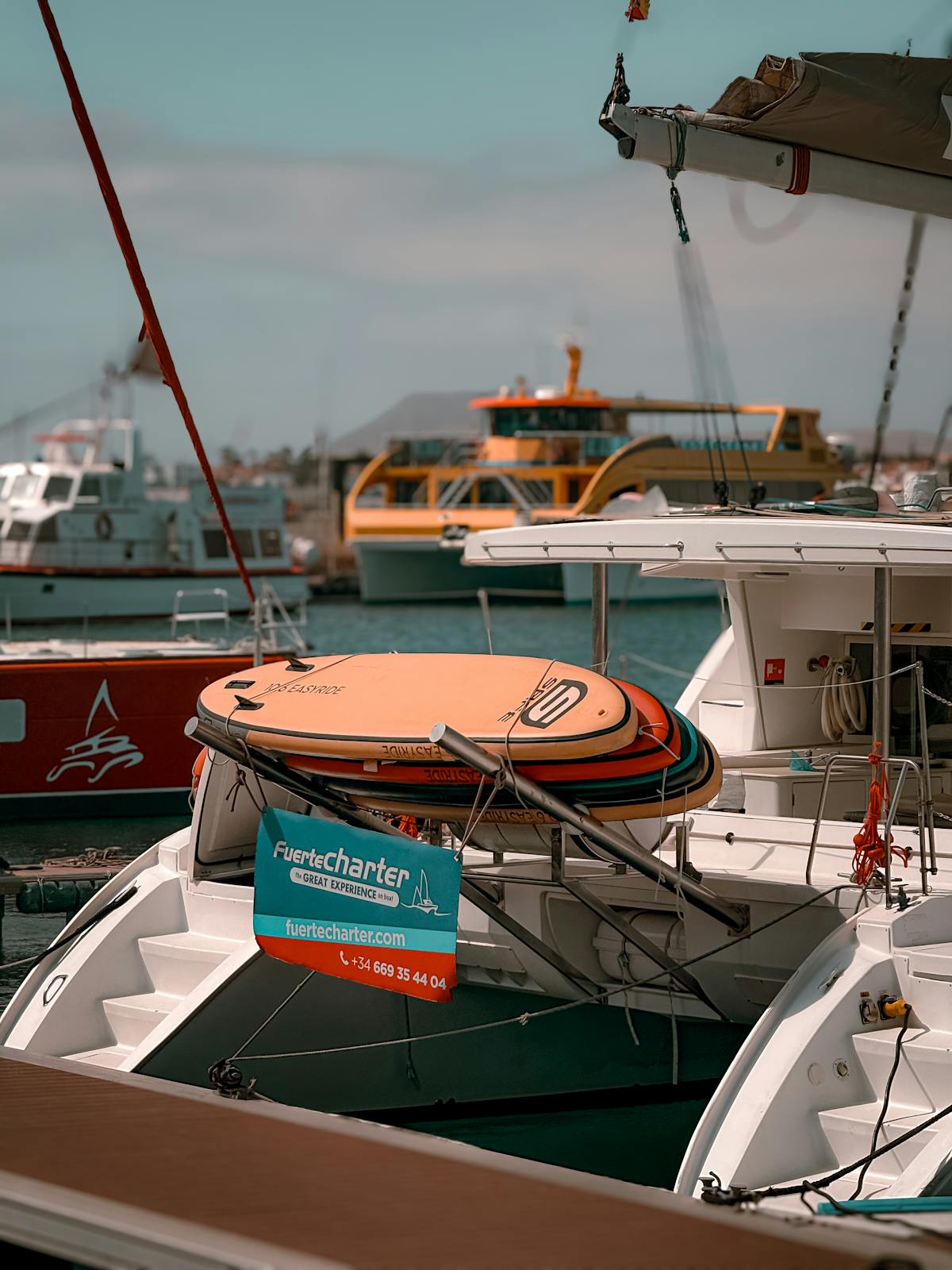 Scenic view of boats and surfboards at Corralejo Harbor in Fuerteventura