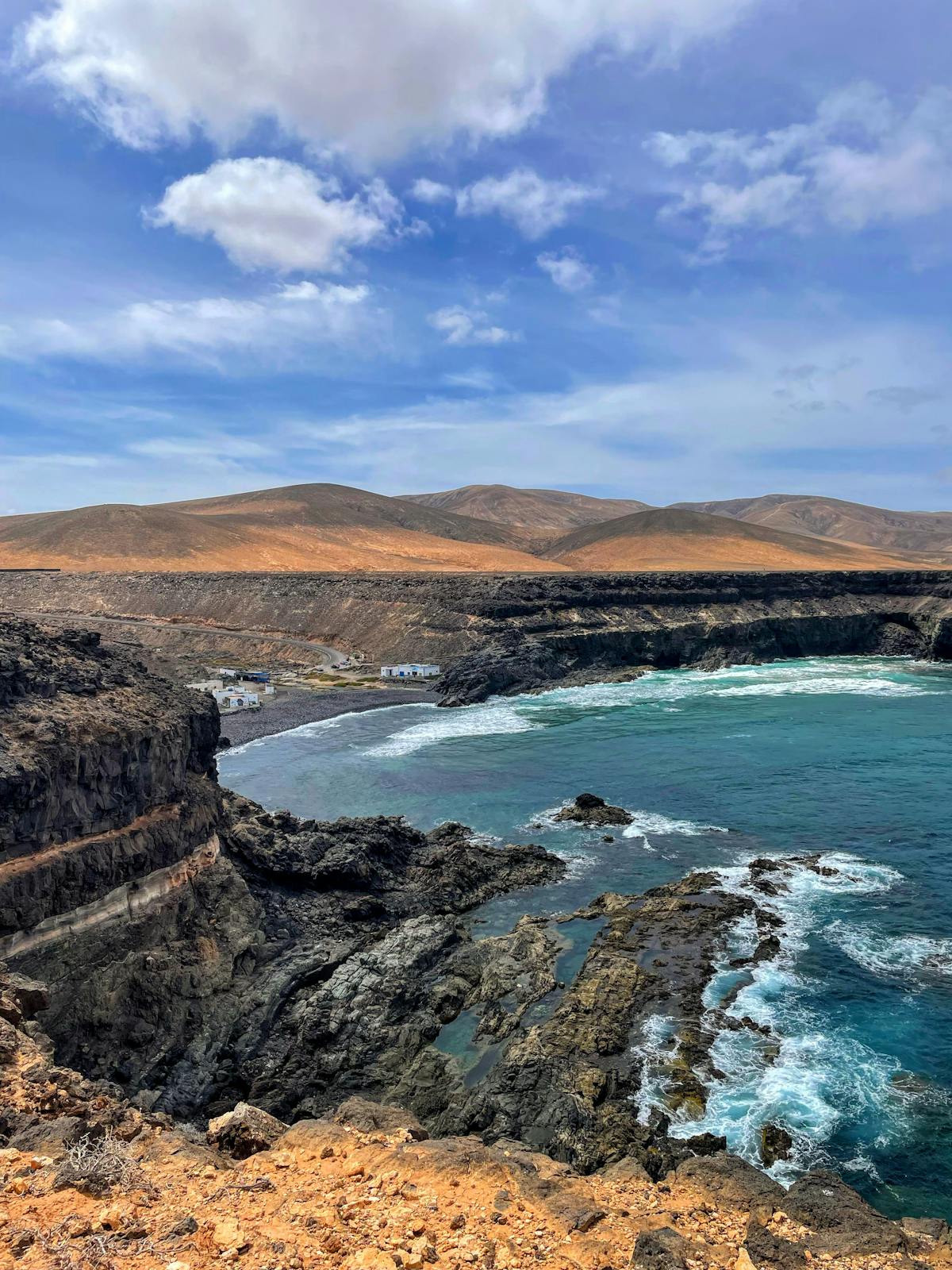 Dramatic cliffs and turquoise waters along the Fuerteventura coastline