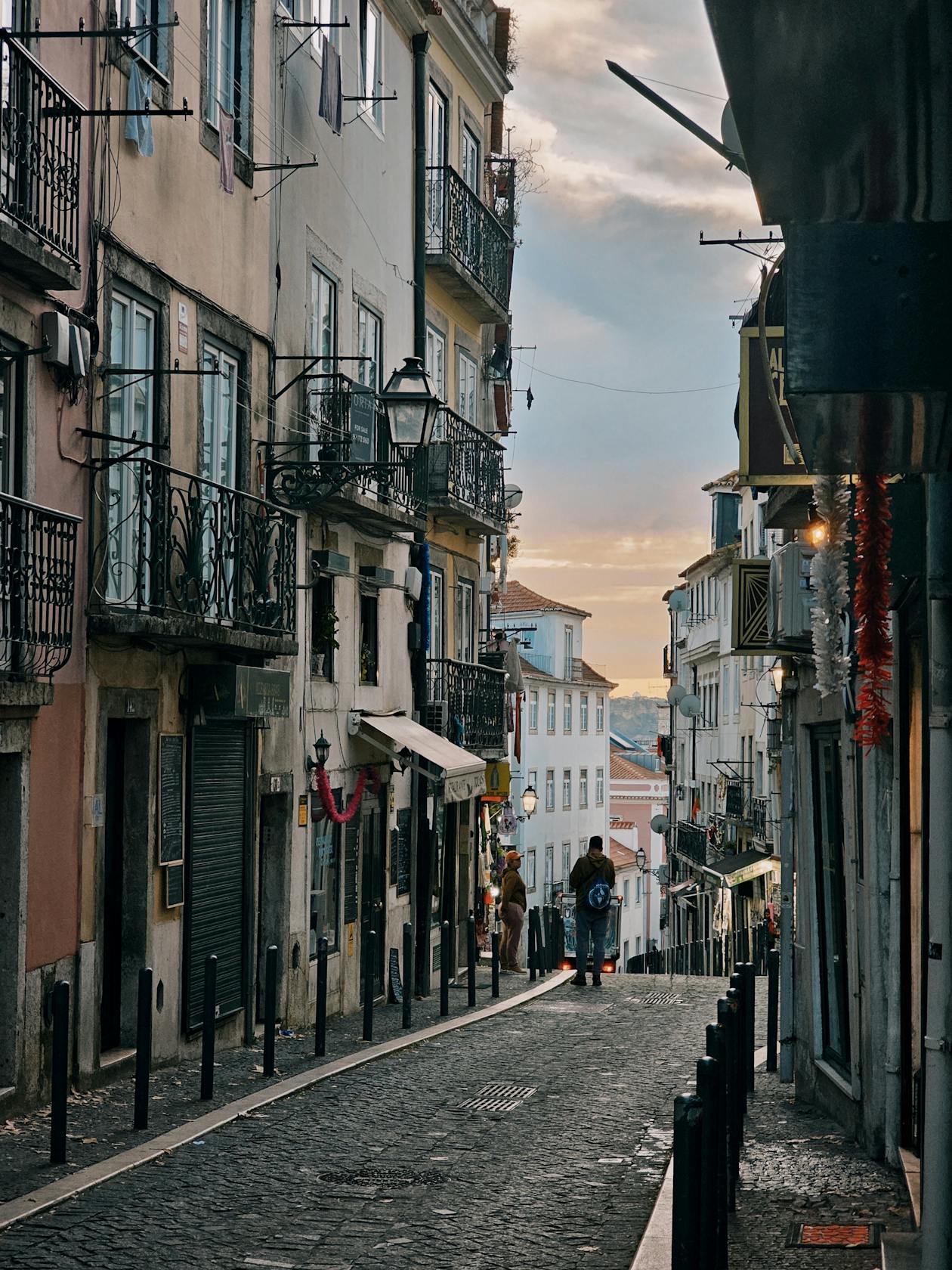 Lisbon street at sunset with traditional architecture