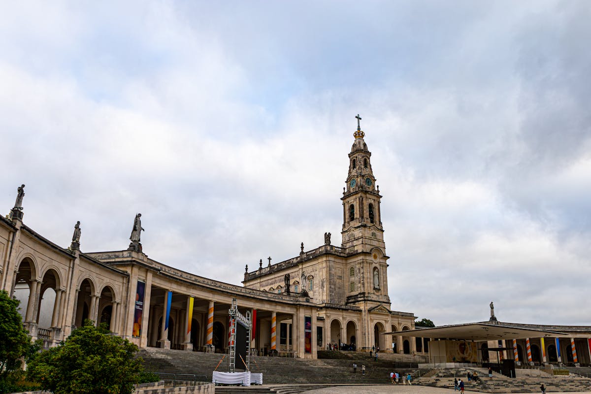 The Sanctuary of Fatima with its white basilica under cloudy skies in Portugal