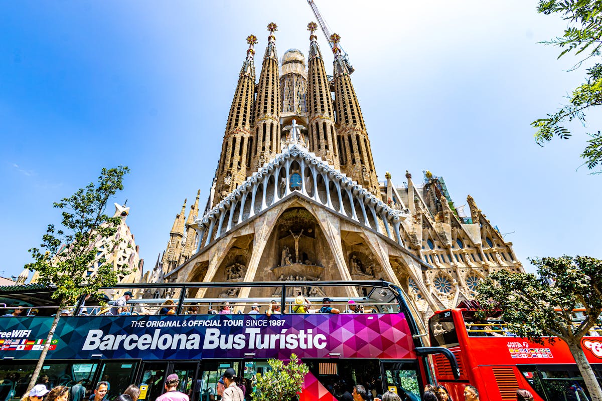 Tourists gathered outside Sagrada Familia on a sunny day in Barcelona