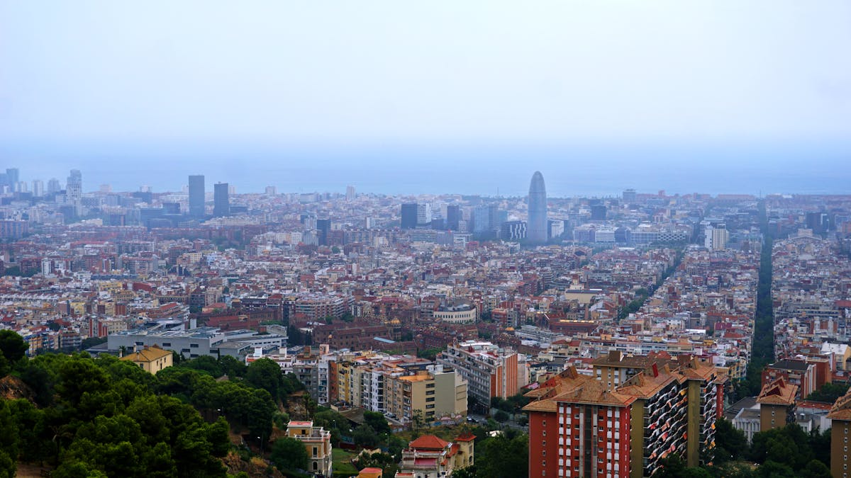 Aerial view of Barcelona cityscape with the Mediterranean Sea in the background