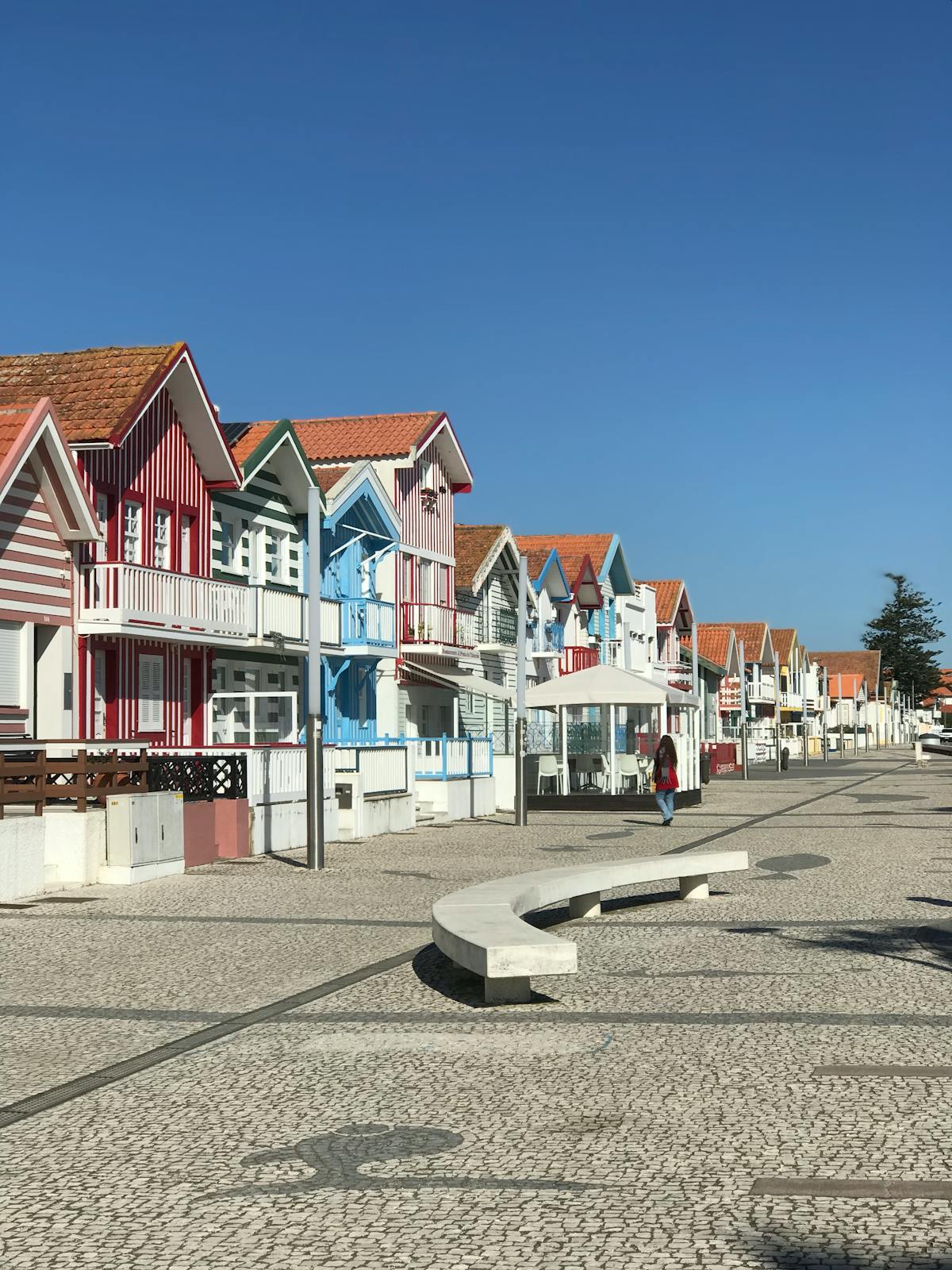 Vibrant candy-striped houses lining the coast in Costa Nova near Aveiro