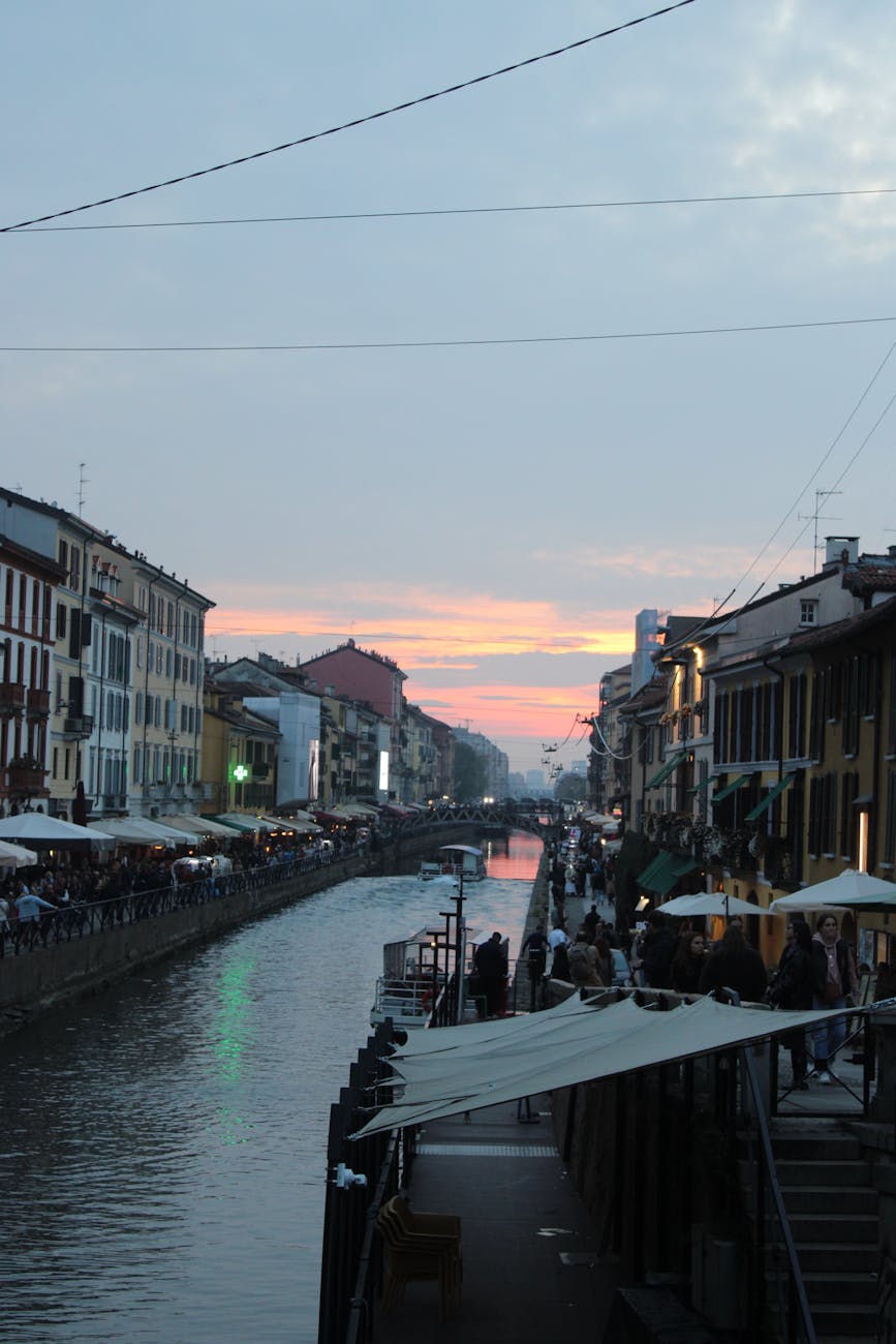 Sunset view over the Navigli canals in Milan with nightlife beginning