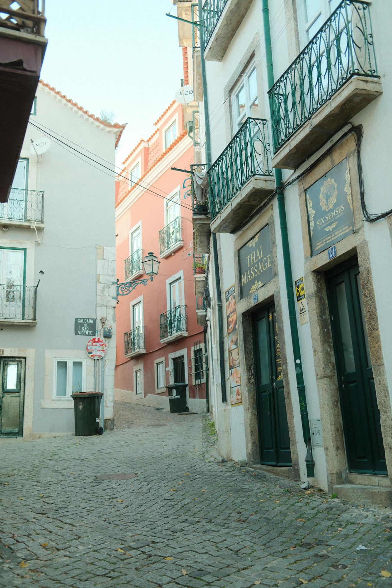 Cobblestone alley in Alfama district on a sunny day