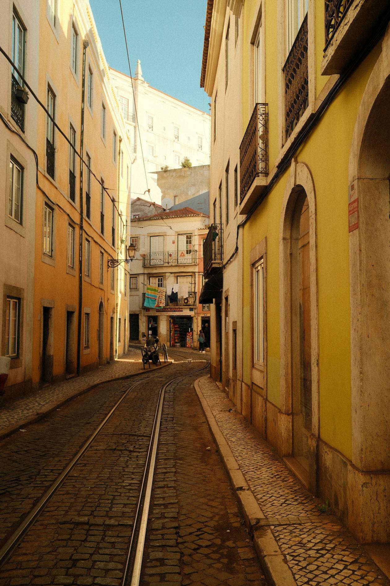 Narrow old town streets with cobblestone in Lisbon