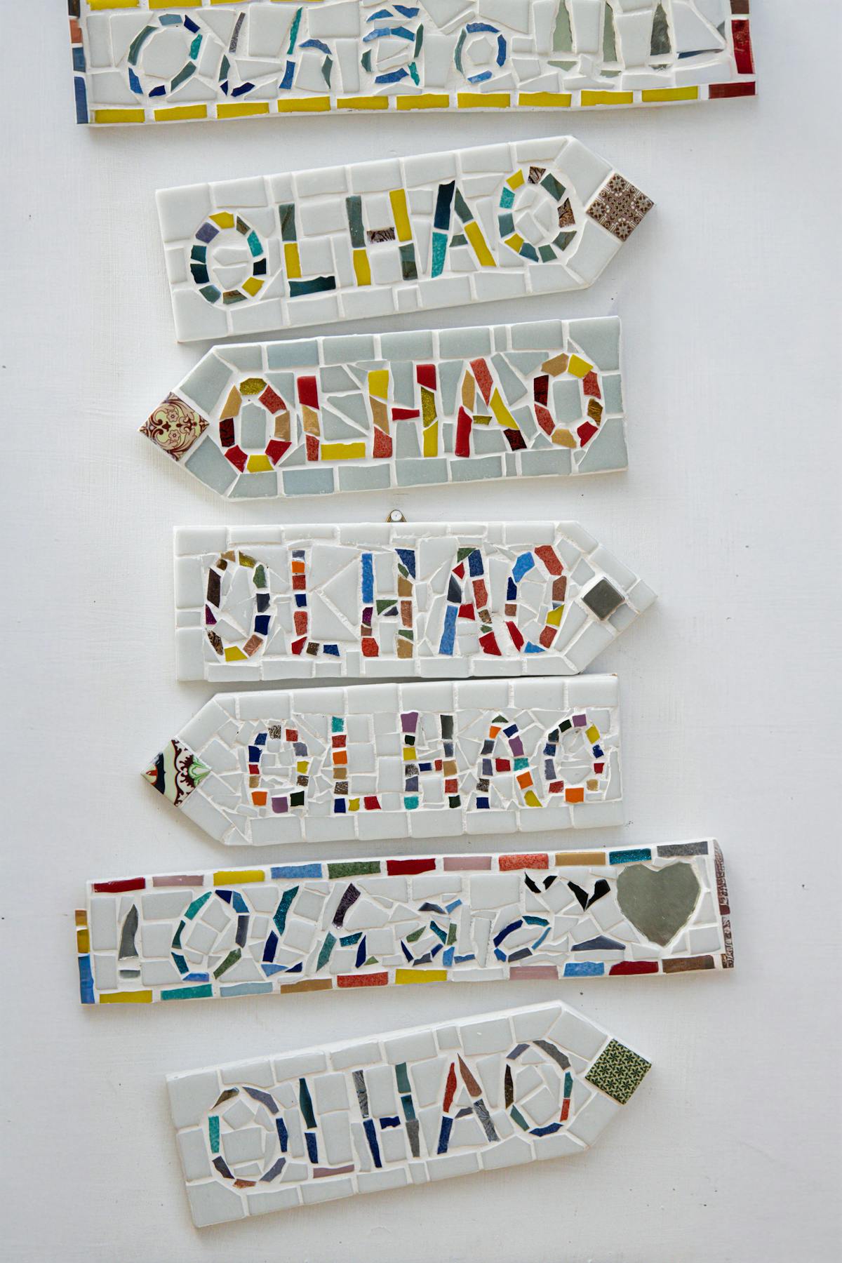 Bright mosaic sign displaying Olhao in colorful tiles Portugal