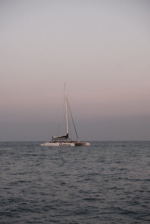 Catamaran sailing at sunset on the Mediterranean