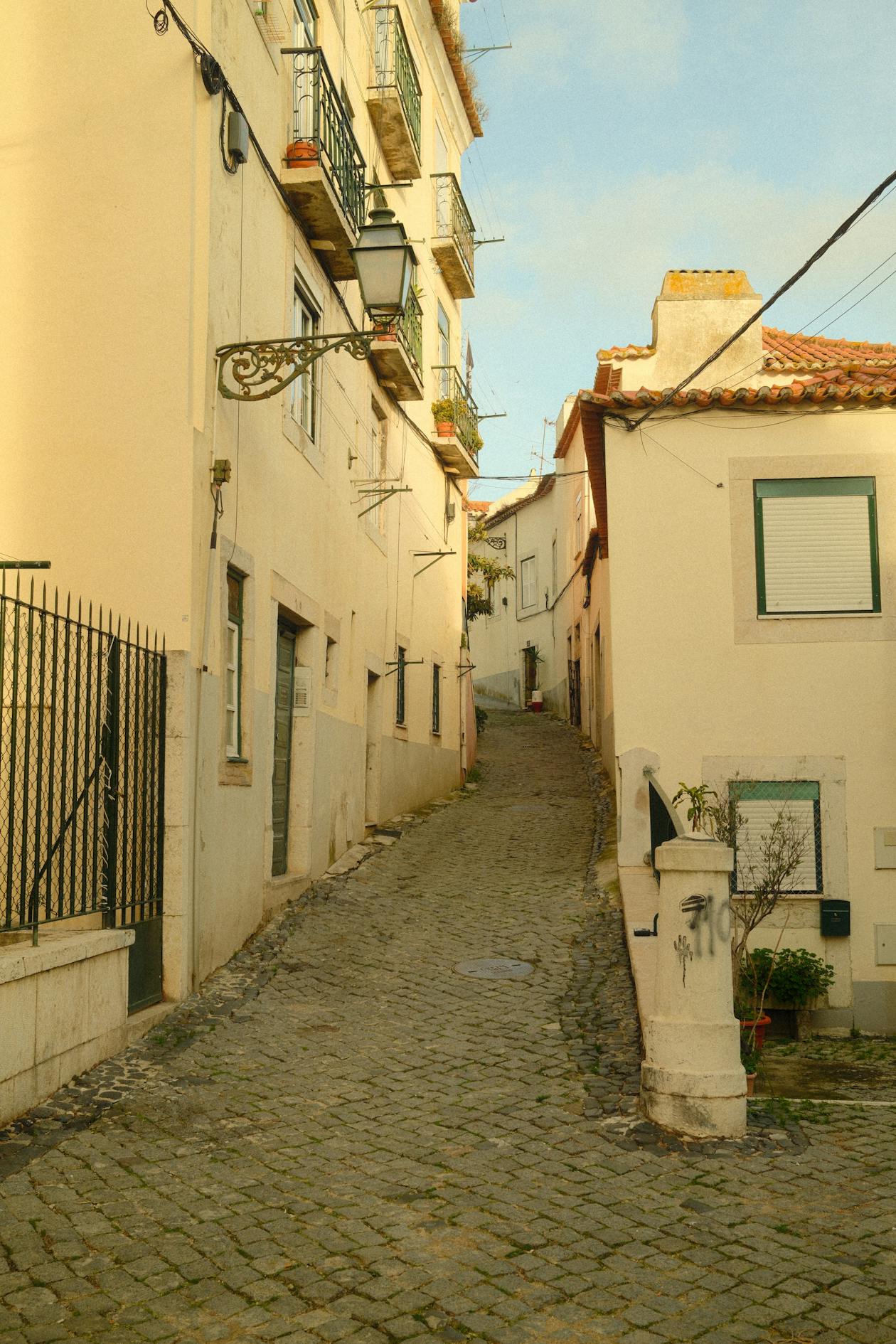 Classic Portuguese architecture in a cobblestone alley in Alfama