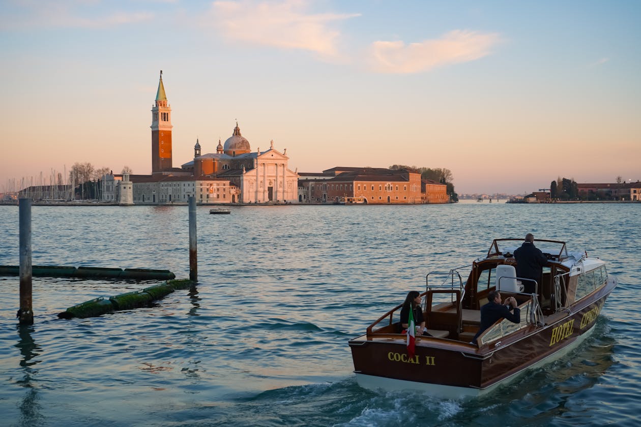 Venice lagoon with passenger boat and San Giorgio Maggiore at sunset