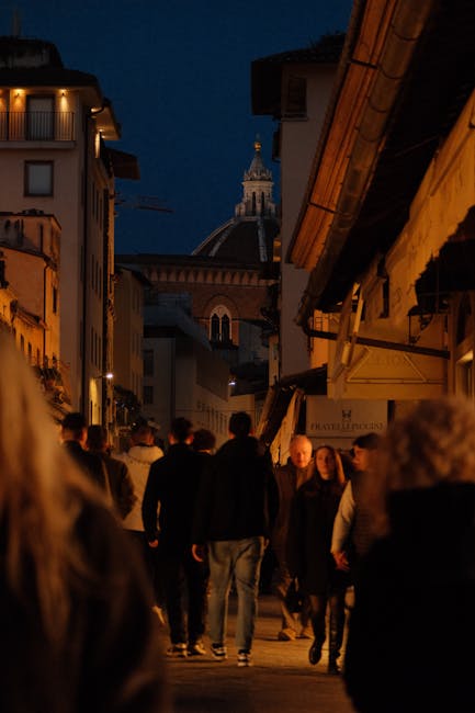 Evening street scene with the Florence Duomo glowing in the background