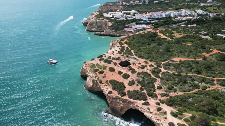Aerial view of the dramatic Algarve cliffs meeting turquoise Atlantic waters