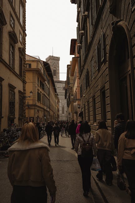 People walking near the Florence Cathedral on a sunny day