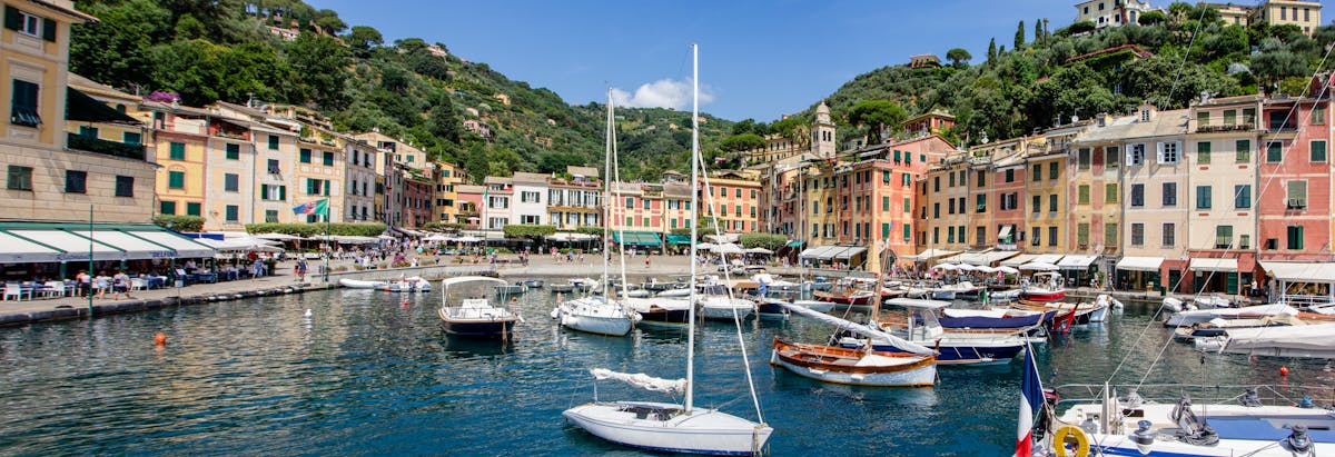 Boats docked at colorful Portofino harbor in Liguria Italy
