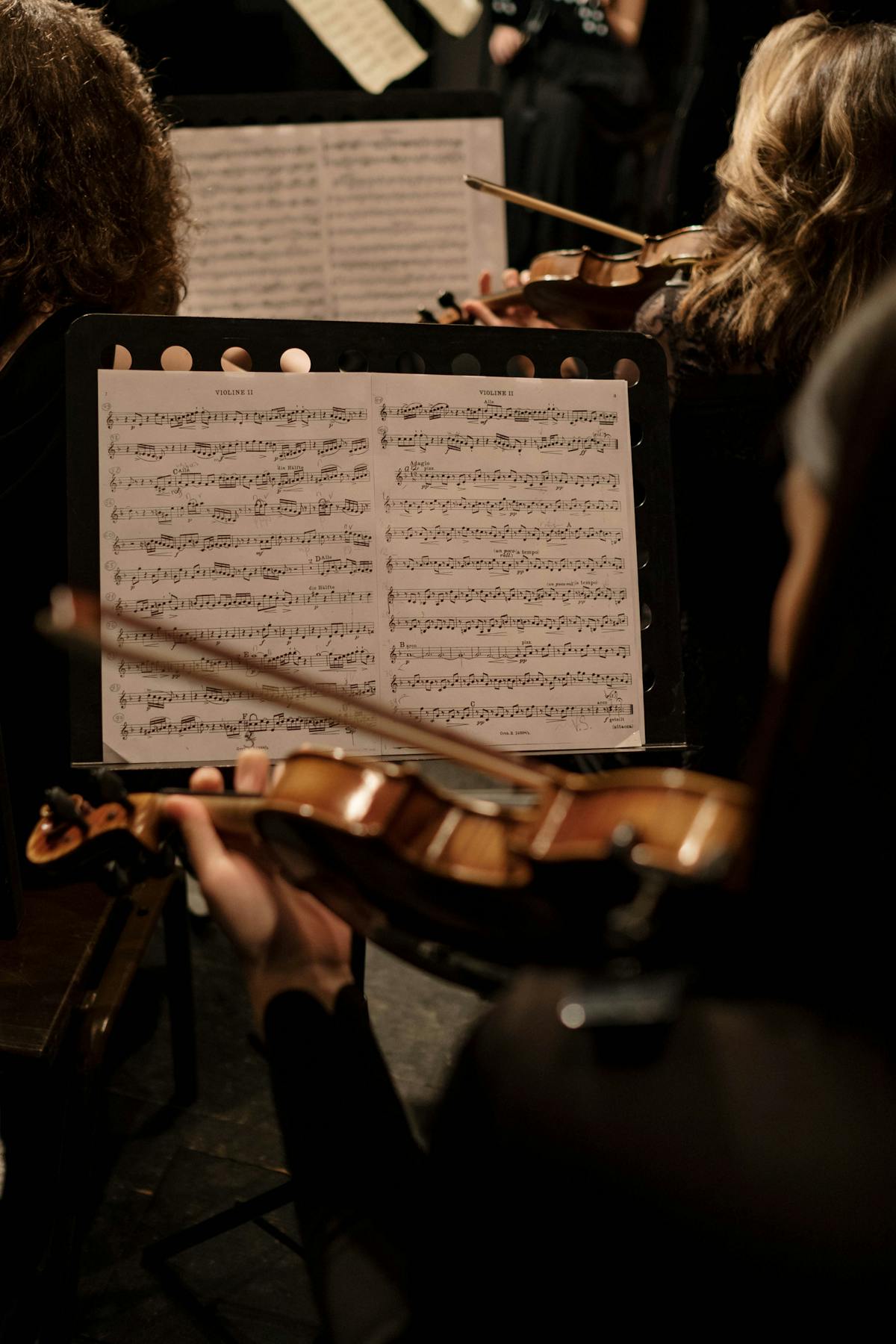 Close-up of a violinist performing during a classical music concert