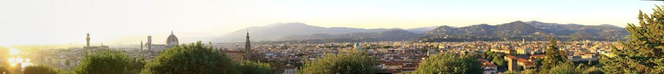 Panoramic view of the Florence skyline at sunset with cathedral dome and surrounding hills