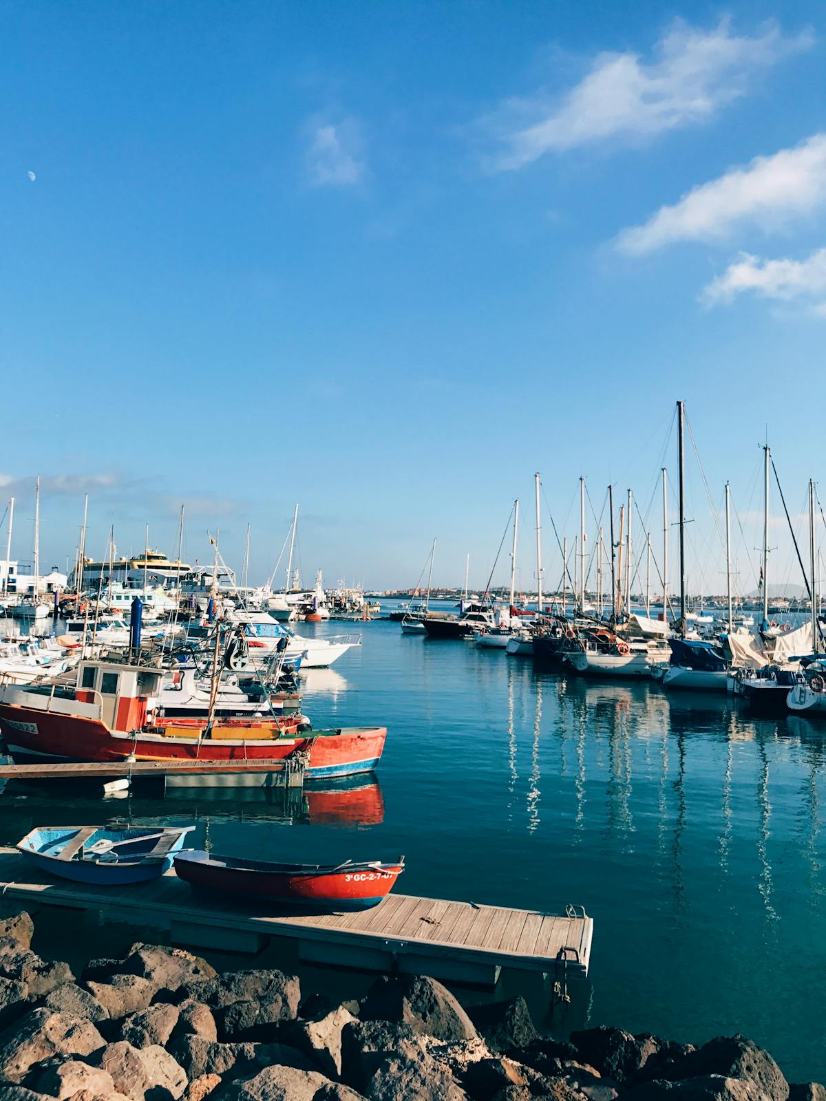 Colorful boats docked at Corralejo harbor in Fuerteventura