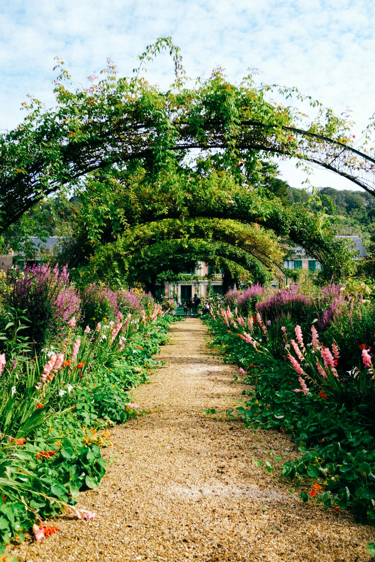 Garden archway and gravel path at Giverny