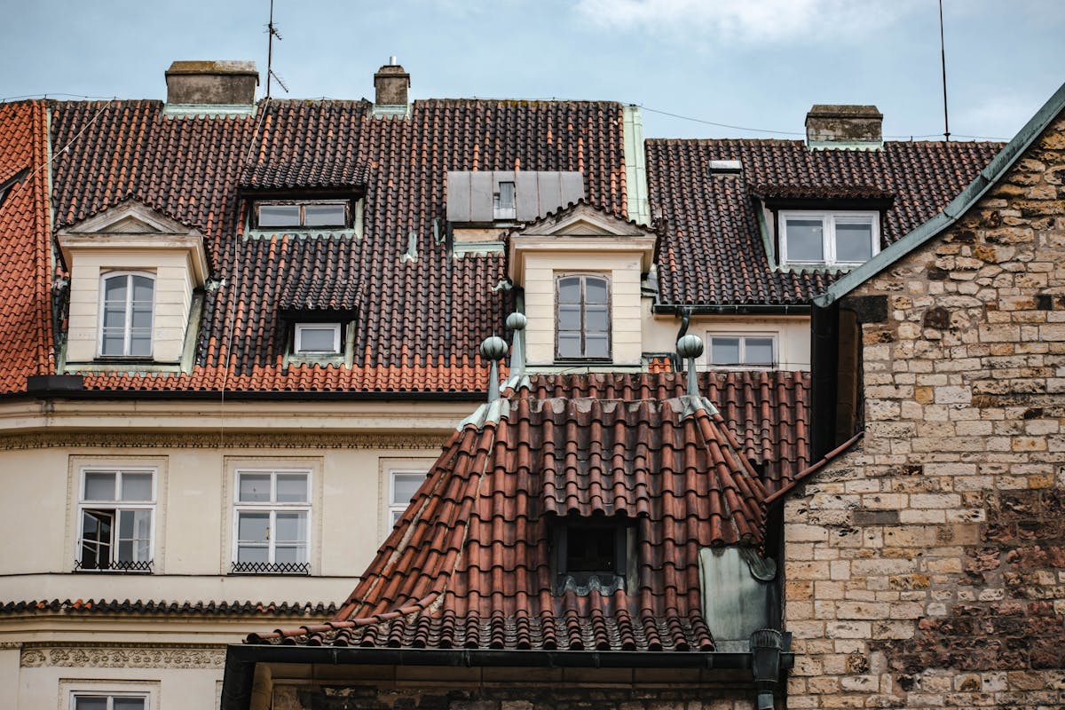 Rooftops of historic buildings in Prague Old Town seen from above