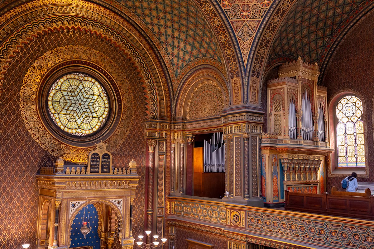 Ornate Moorish interior of the Spanish Synagogue in Prague with detailed geometric patterns