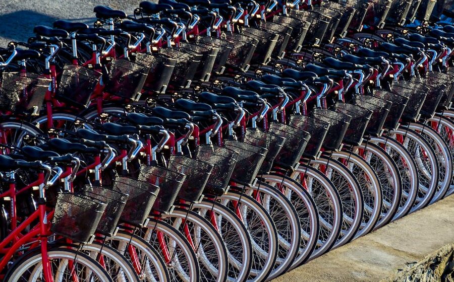 A row of red rental bicycles parked in Stockholm