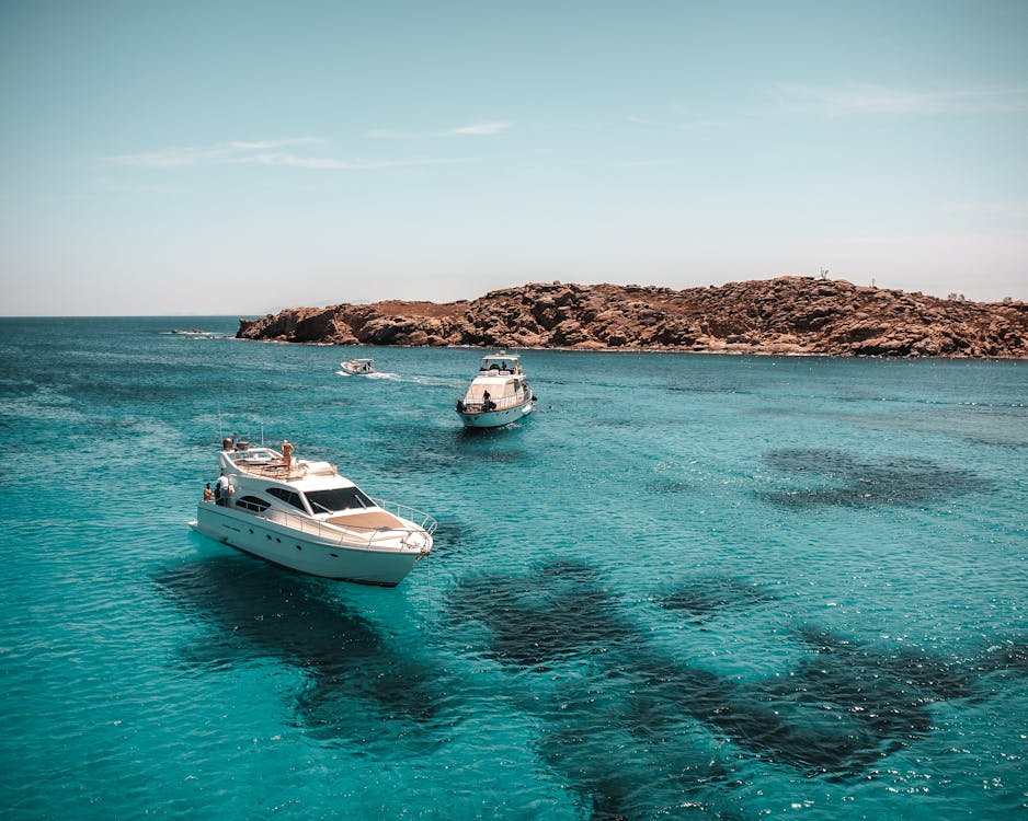 Aerial view yachts on blue water Greek islands