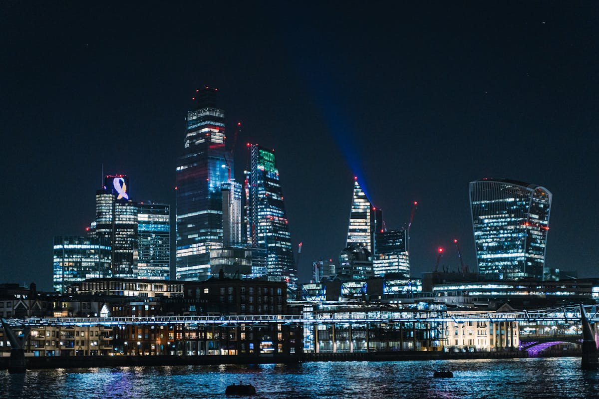 London skyline at night with The Shard and modern skyscrapers illuminated