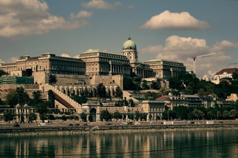 Scenic view of Buda Castle overlooking the Danube River in Budapest on a partly cloudy day