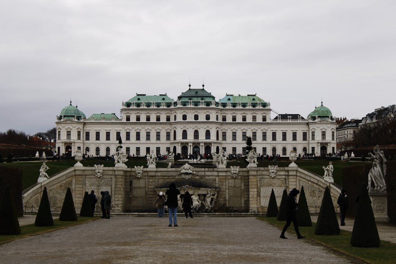 Belvedere Palace with statues and gardens in winter Vienna under grey sky