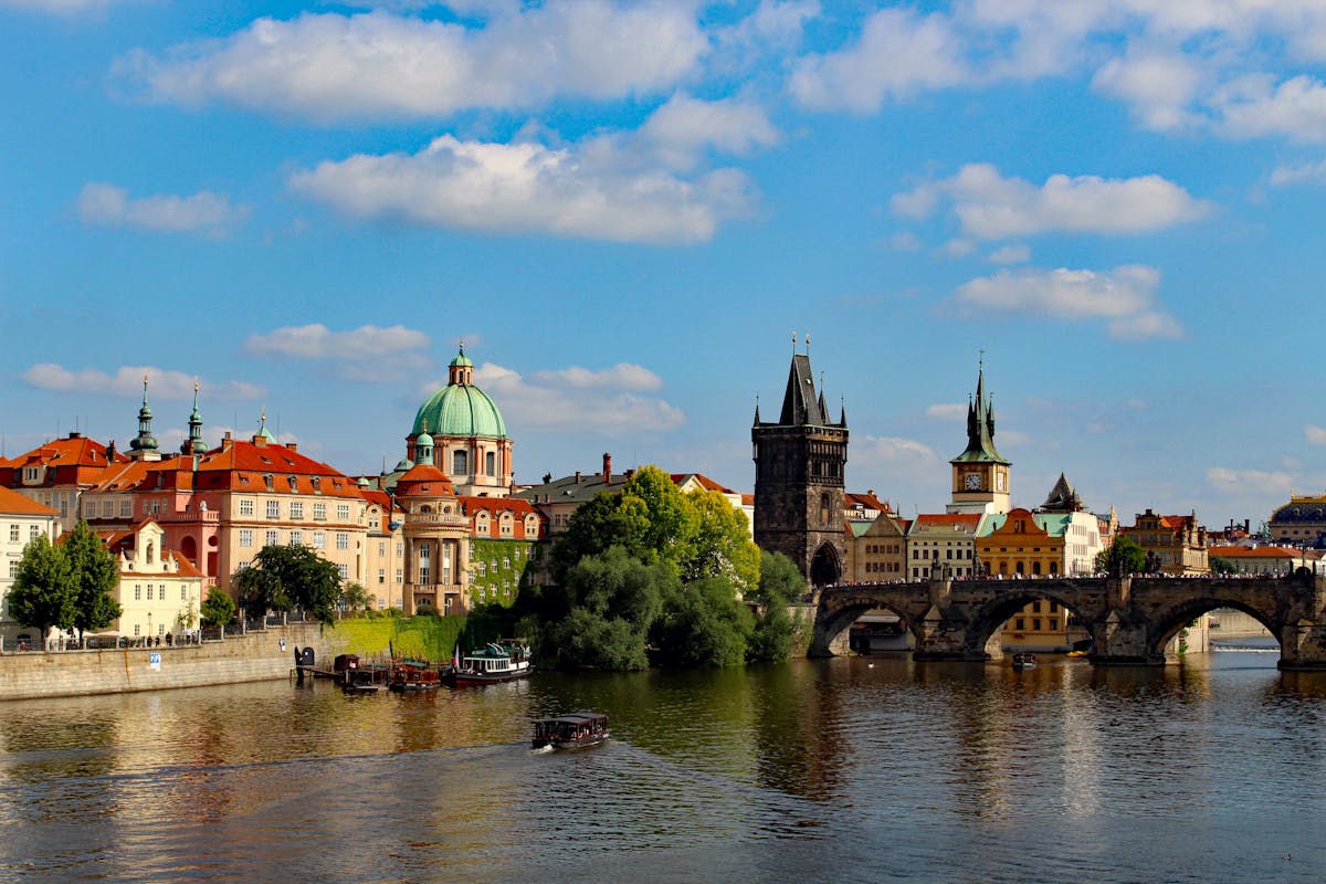 Charles Bridge spanning the Vltava River with Prague's historic skyline