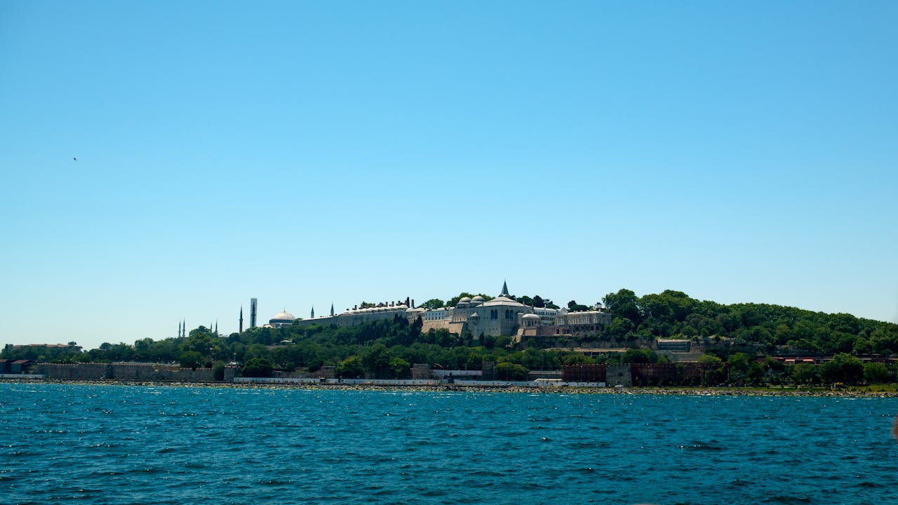 Scenic view of Topkapi Palace seen from a boat on the Bosphorus Strait
